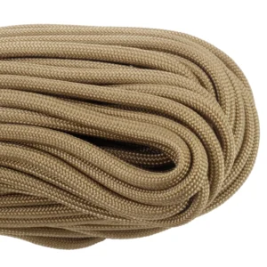 a closeup of 550 paracord - tan on a white background