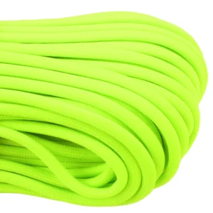 a closeup of 550 paracord - neon green on a white background