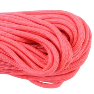 a closeup of 550 paracord - pink on a white background