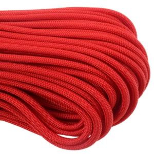 a closeup of 550 paracord - red on a white background