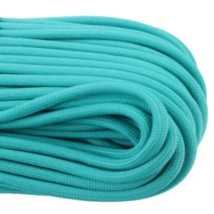 a closeup of 550 paracord - teal on a white background